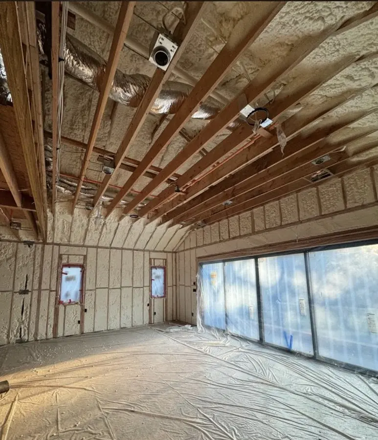 Interior walls and ceiling insulated with spray foam during new construction in College